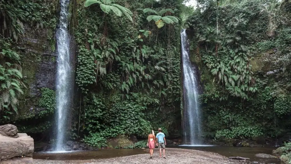 View of tourists visiting the Benang Stoke and Benang Kelambu Waterfall in Lombok on a tour
